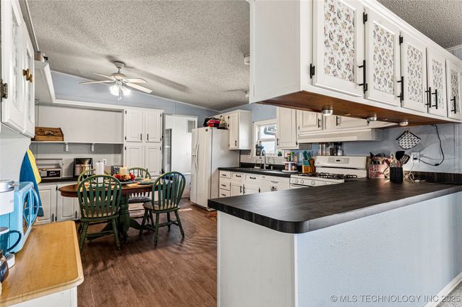 Kitchen has been updated with new countertops and flooring, fresh interior paint, new sink and fixtures. | Image 19