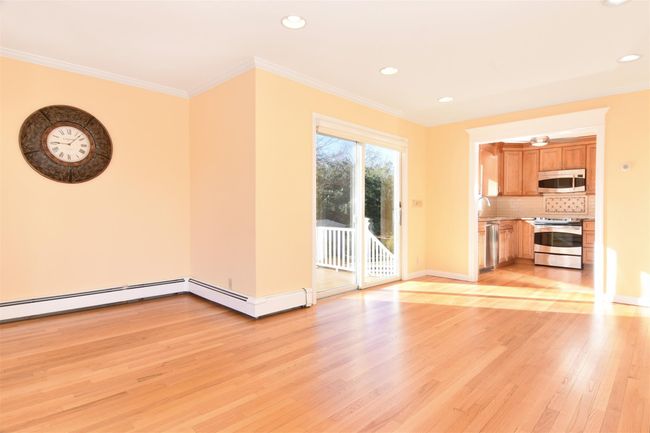 First Floor Family Room with baseboards, light wood finished floors, and ornamental molding | Image 6
