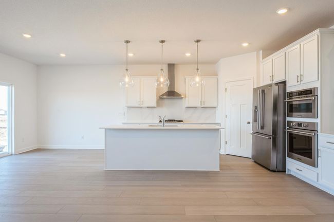 (*Photo of similar home, actual homes colors and finishes will vary) Enjoy plenty of storage space in all the cabinets! | Image 19