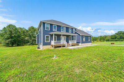 View of front facade featuring a porch and a front lawn | Image 3