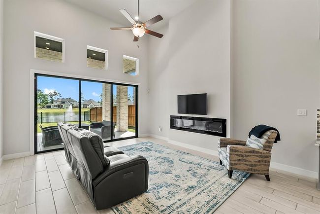 High ceilings and a slider wall give such a spacious and bright feel to this room. | Image 12