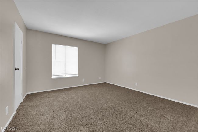 Empty room with dark colored carpet and baseboards | Image 14