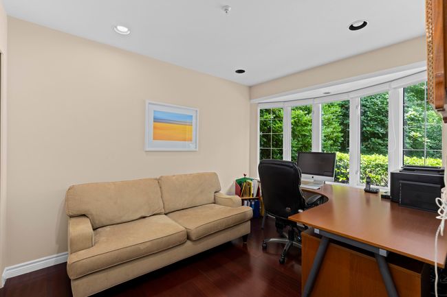 Office featuring dark wood-type flooring and recessed lighting | Image 14
