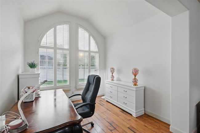 Separate sitting area off of the primary bedroom - perfect place for an additional study, workout room, or just a quiet place to curl up with a good book. | Image 25