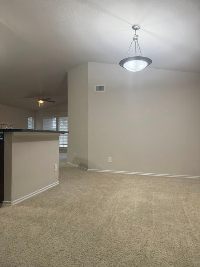 Unfurnished room featuring ceiling fan and carpet | Image 10
