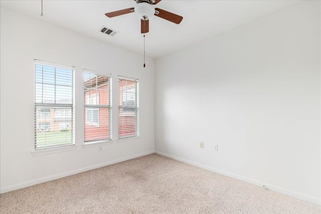 Numerous windows in bedroom #2 offer abundant natural light. | Image 22