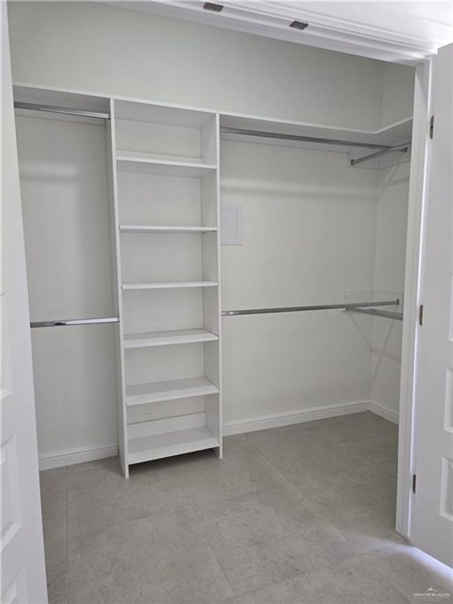 Walk in closet with tile patterned floors | Image 10