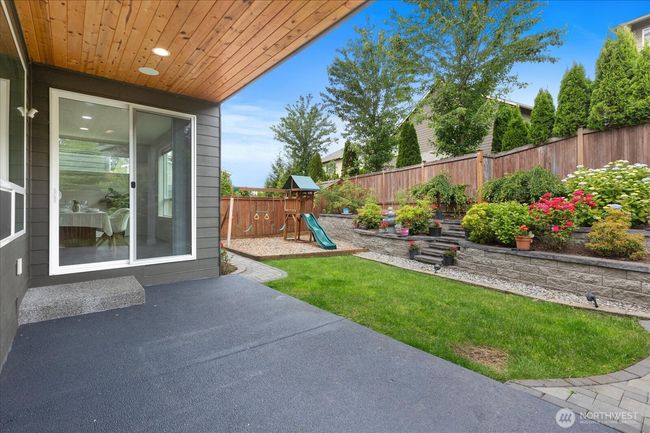 Covered patio looking in backyard | Image 33
