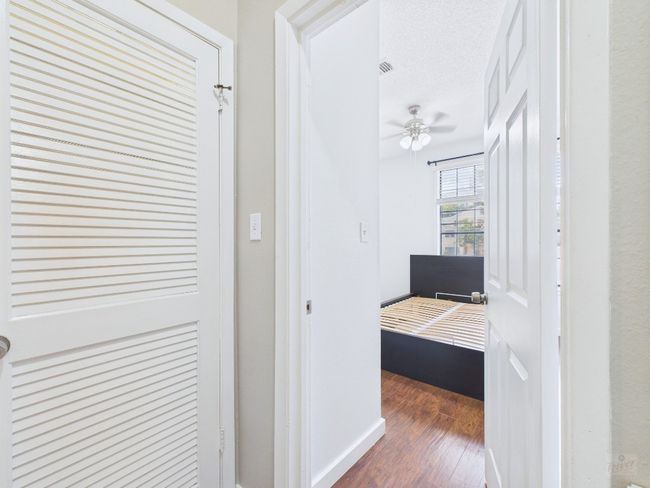Hall featuring wood finished floors and baseboards | Image 17