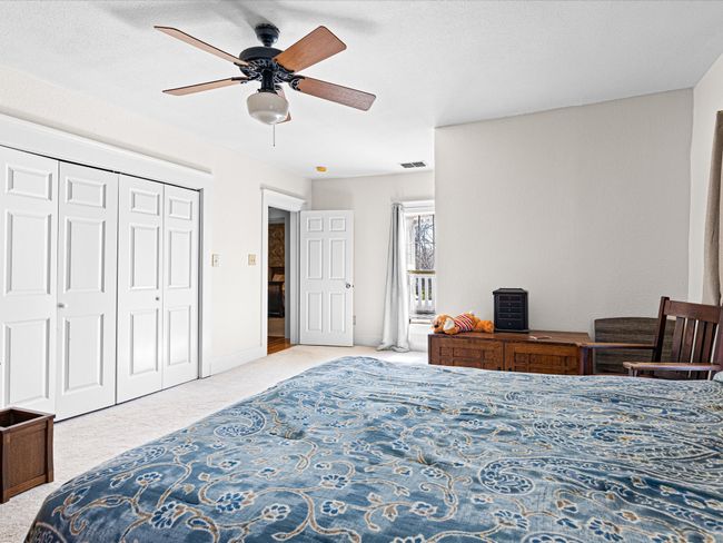 Bedroom with a closet, visible vents, a ceiling fan, and carpet floors | Image 24