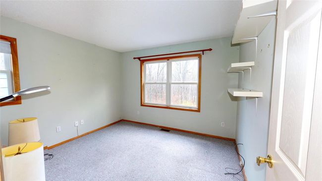 Carpeted empty room with visible vents and baseboards | Image 20