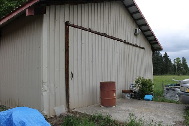 View of outbuilding featuring an AC wall unit | Image 5