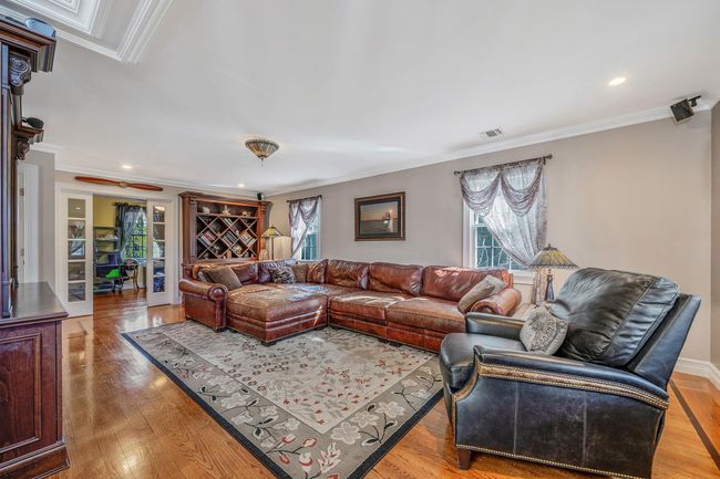 Living room featuring visible vents, ornamental molding, recessed lighting, and light wood-type flooring | Image 8