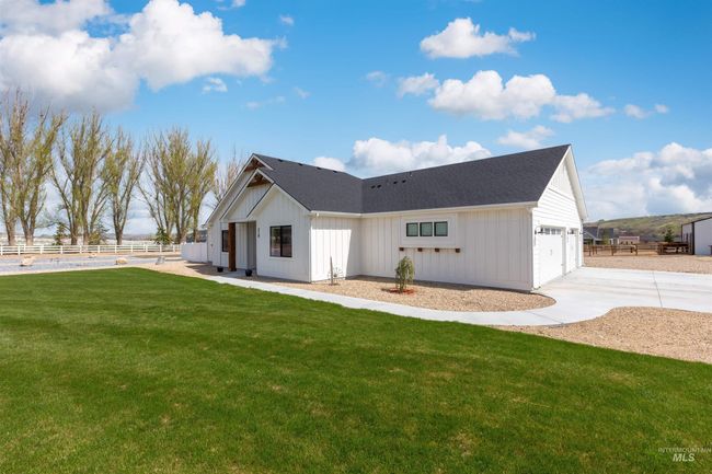 Back of house featuring board and batten siding and driveway | Image 37