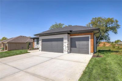 Garage featuring a yard | Image 3