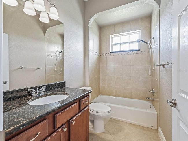 Guest bathroom w/Tiled Tub & Shower combination | Image 47
