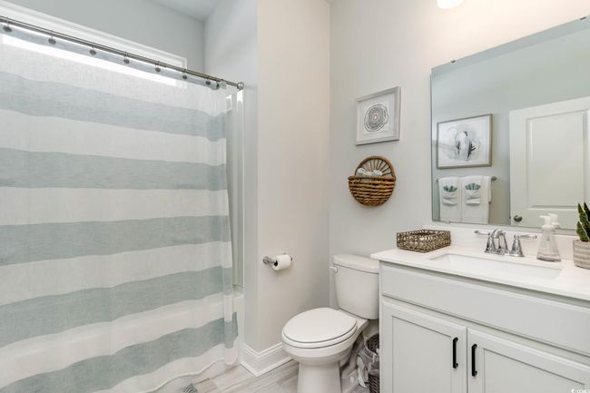Full bath featuring vanity and wood finished floors | Image 13