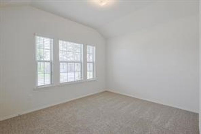 Unfurnished room featuring lofted ceiling and carpet floors | Image 14