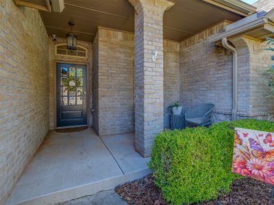 Doorway to property featuring a porch | Image 2