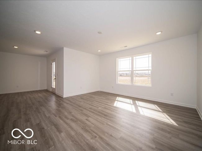 unfurnished room with recessed lighting, baseboards, and dark wood-type flooring | Image 18