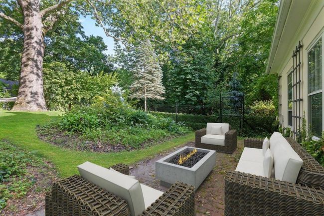 View of patio / terrace featuring an outdoor living space with a fire pit | Image 27