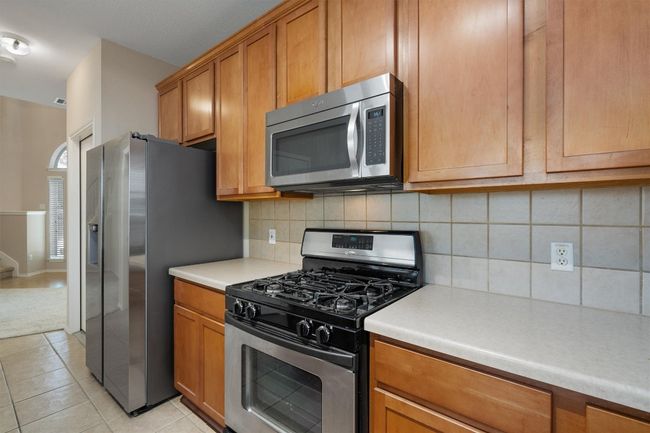 Kitchen featuring stainless steel appliances | Image 12