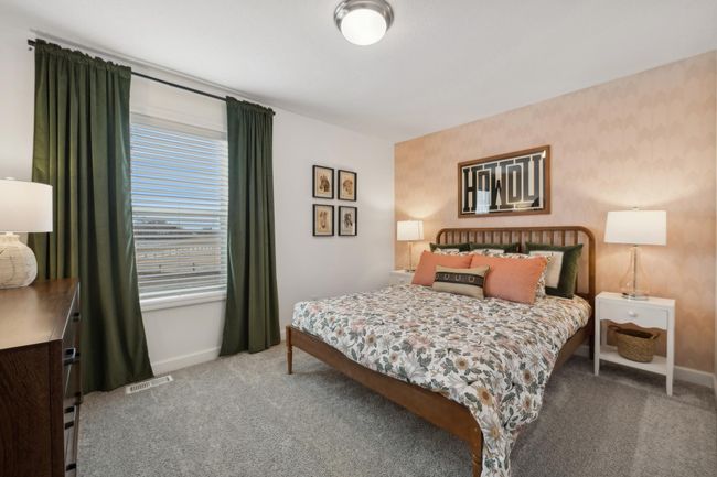 (Photo of decorated model, actual home's finishes may vary slightly) One of three generously sized bedrooms. | Image 12