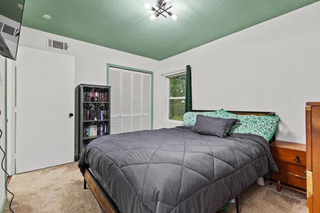 Carpeted bedroom featuring a closet and a textured ceiling | Image 20