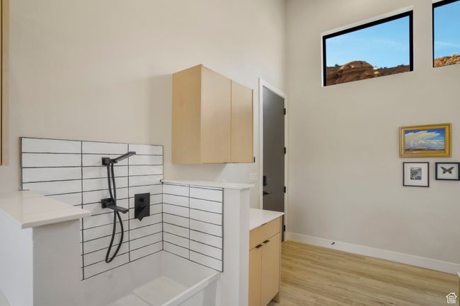 Hallway featuring light wood-style flooring and baseboards | Image 37