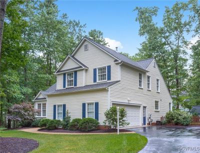 View of property with a garage | Image 2