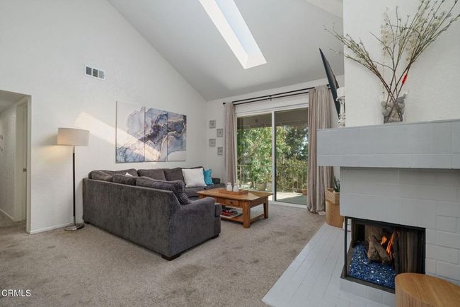 Living Room with Fireplace and Skylight | Image 10