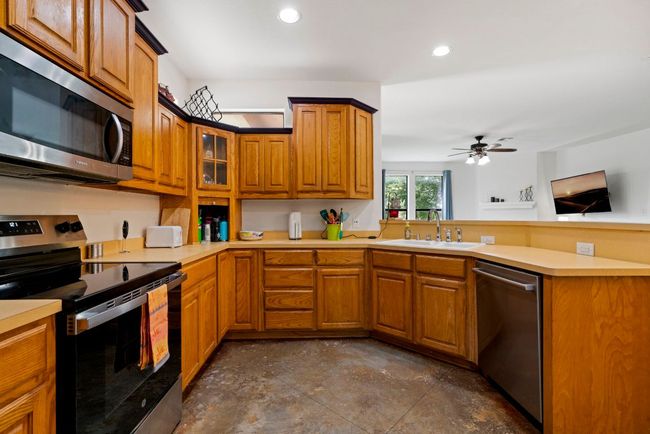 Durable Formica counters and solid wood cabinets offer timeless function and style that won’t flinch at daily use. | Image 13