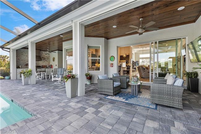View of patio / terrace featuring ceiling fan, a lanai, and an outdoor hangout area | Image 20