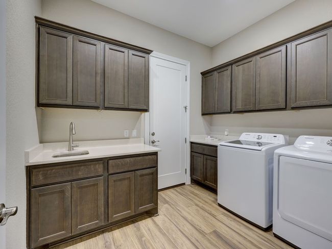 Spacious laundry room with sink | Image 31