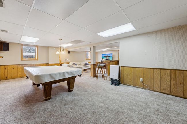 Lower level rec room with plush carpet and ample room for entertaining friends and family | Image 15