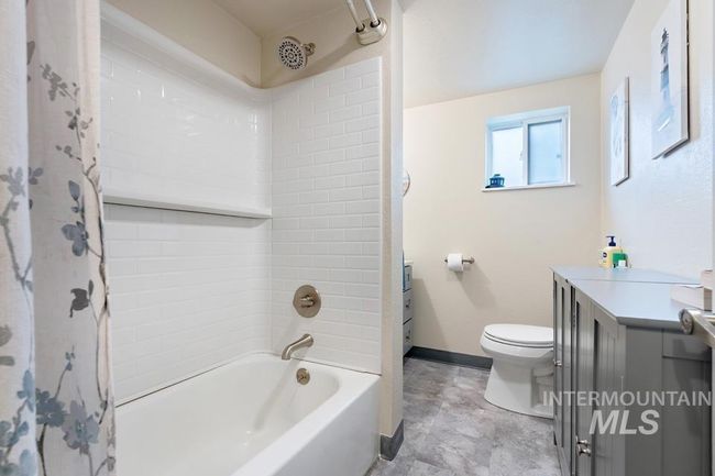 Full bathroom featuring vanity and shower / tub combo | Image 18