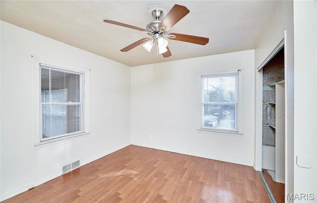 Bedroom number 2, featuring ceiling fan and light wood-type flooring | Image 10