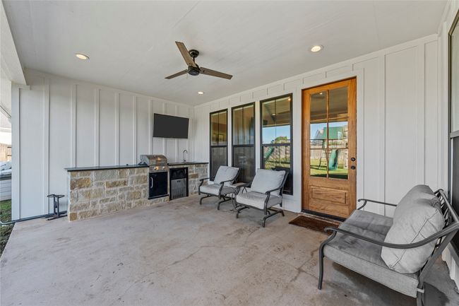 View of patio / terrace featuring a sink, grilling area, and ceiling fan | Image 34
