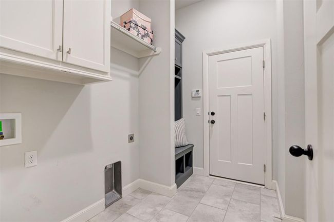 Large utility room and a mudroom nook for storage. | Image 27
