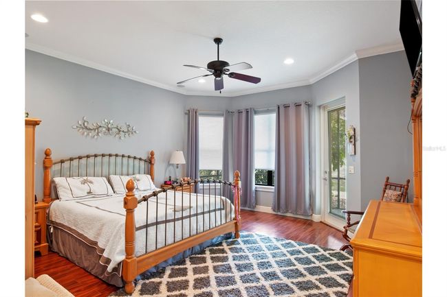 Master bedroom with lovely view of the golf course. | Image 12