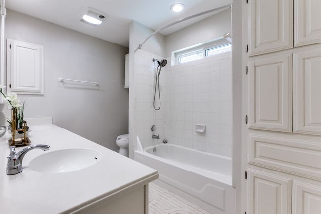 Full bathroom with double vanity and tub / shower combination | Image 19