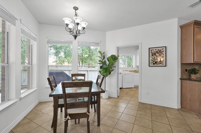 Start your day surrounded by natural light in this cheerful breakfast area. | Image 18