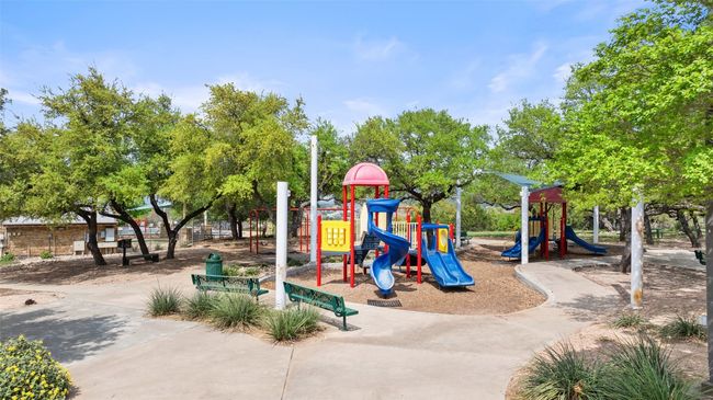 Community park with shaded playground, open green space, and covered picnic areas. | Image 37