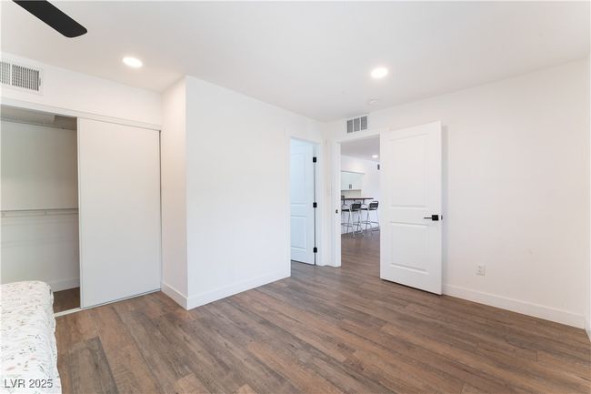 Unfurnished bedroom featuring visible vents, wood finished floors, and recessed lighting | Image 19