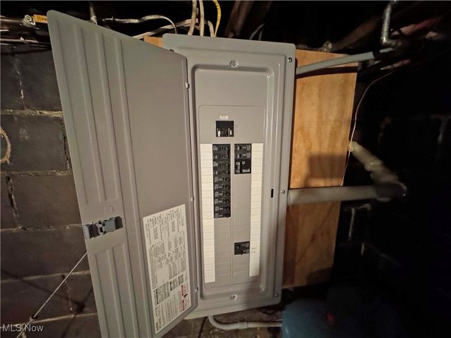 Utility room with electric panel | Image 45