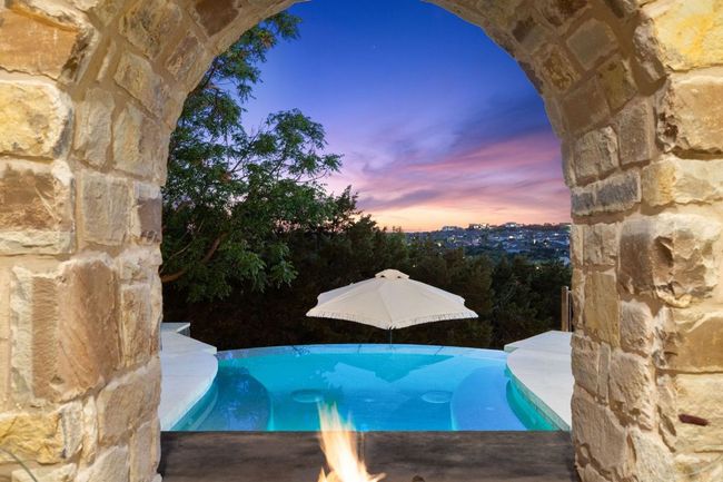 View of pool at dusk | Image 4