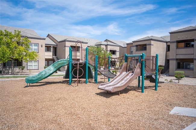 Community jungle gym with a residential view | Image 34