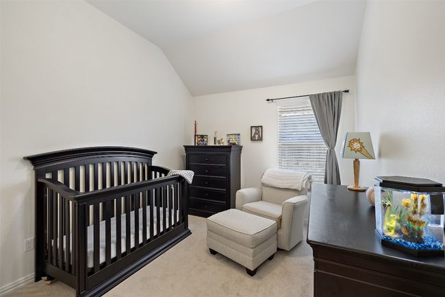Comfortable and versatile secondary bedroom offering great space and natural light. | Image 24