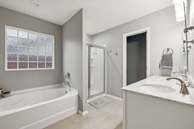 Newly updated primary suite bathroom. New vanity, mirror and lights. | Image 32
