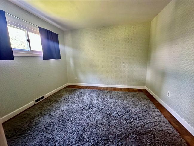 Unfurnished room with hardwood / wood-style flooring | Image 19